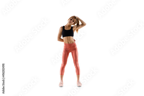 Strong. Young caucasian female model in action, motion isolated on white background with copyspace. Concept of sport, movement, energy and dynamic, healthy lifestyle. Training, practicing.