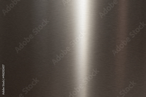 Brushed dark stainless steel metallic surface. background mit space for text. Top view.