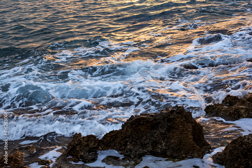 Blurred abstract natural background of sea water with waves and foam. Motion blur. Nature. 