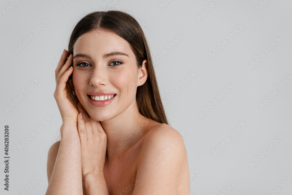 Happy shirtless girl smiling and looking at camera Happy shirtless girl smiling and looking at camera