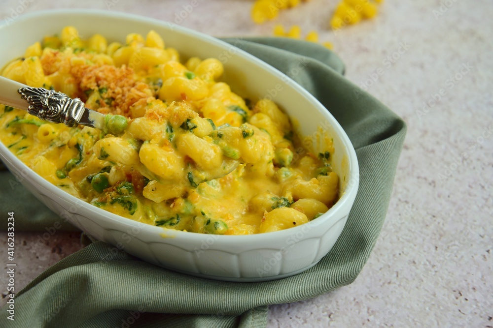 Creamy baked cavatappi pasta with sweet potato, cheddar cheese, peas and spinach garnish with panko crumbs Creamy baked cavatappi pasta with sweet potato, cheddar cheese, peas and spinach garnish with panko crumbs