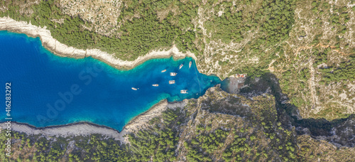 Fototapeta Naklejka Na Ścianę i Meble -  Aerial overhead drone shot of Stiniva covert cove beach in Adriatic sea on Vis Island in Croatia in summer
