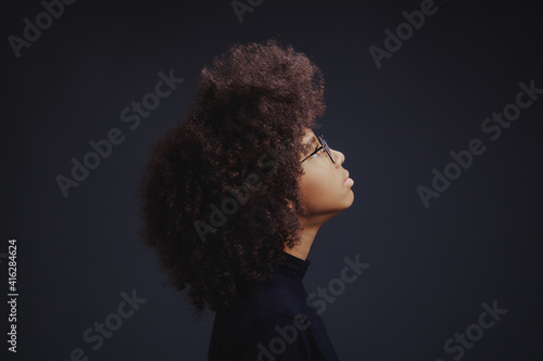 Portrait of teenage girl looking up