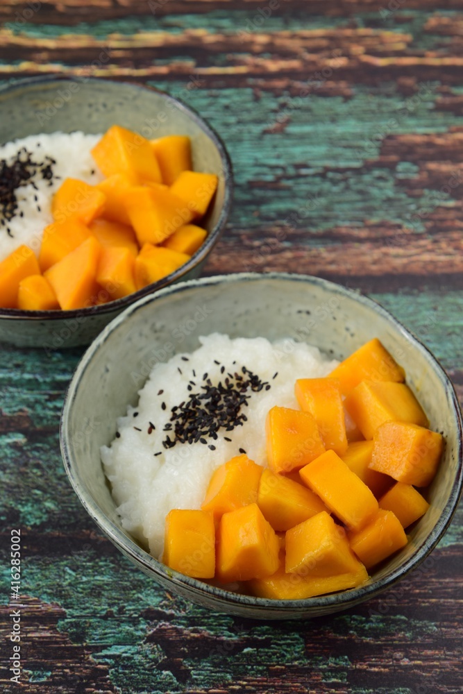 Mango sticky rice with black sesame seeds, Thai dessert