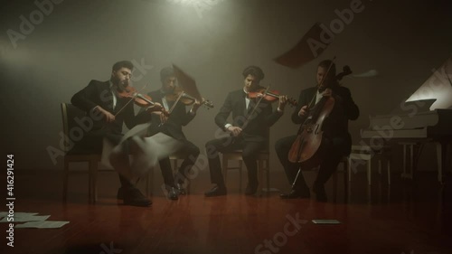the string quartet plays classical music,notes fall from the air photo