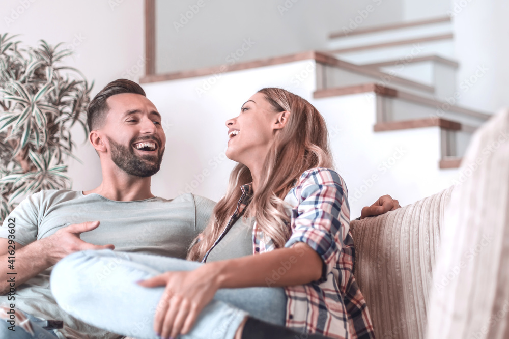 loving couple relaxing on the couch on a free evening loving couple relaxing on the couch on a free evening