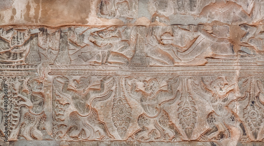 Design of historical walls with mistical animals of Angkor What temple, 12th century Khmer landmark. Cambodian complex and UNESCO World Heritage Site
