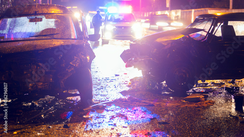 Night slippy road car accident. Car crash in police light. photo