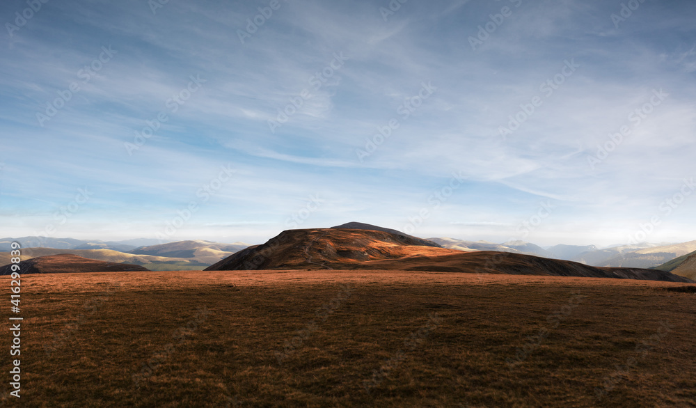 Nature, summer landscape in carpathian mountains,  grass on hills, beautiful cloudy sky