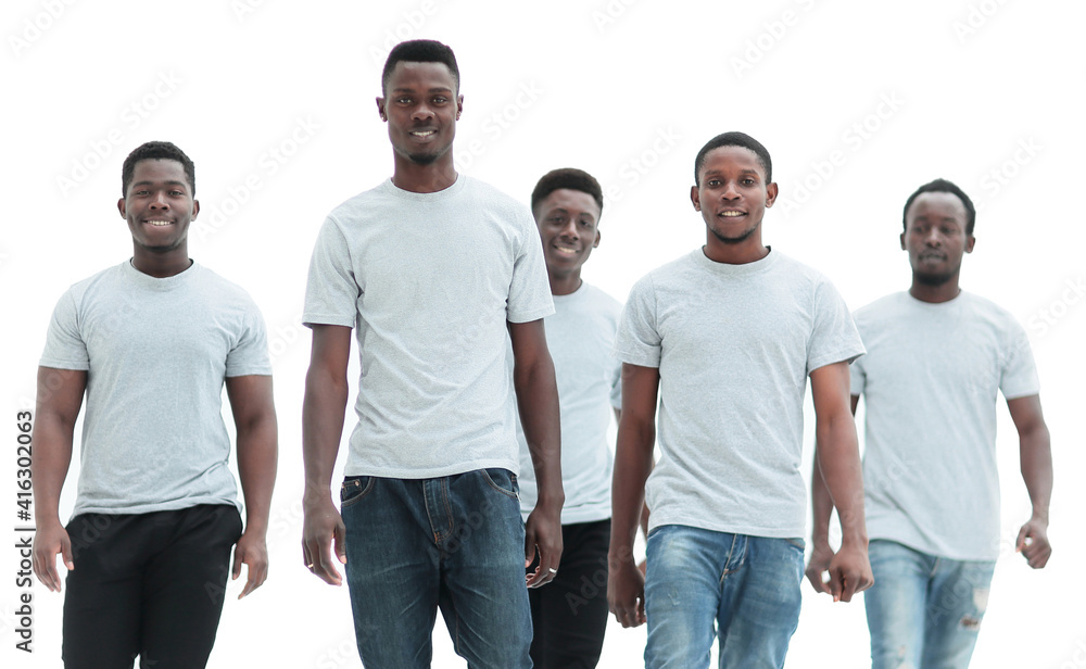 in full growth. a team of confident modern guys standing together in full growth. a team of confident modern guys standing together