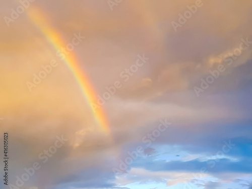 detail of rainbow arch in sunset sky and clouds  © juliana