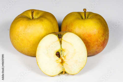 Ripe Boskoop apples on a white background in section