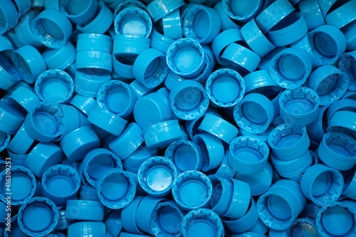 blue plastic bottle caps background, isolated picture