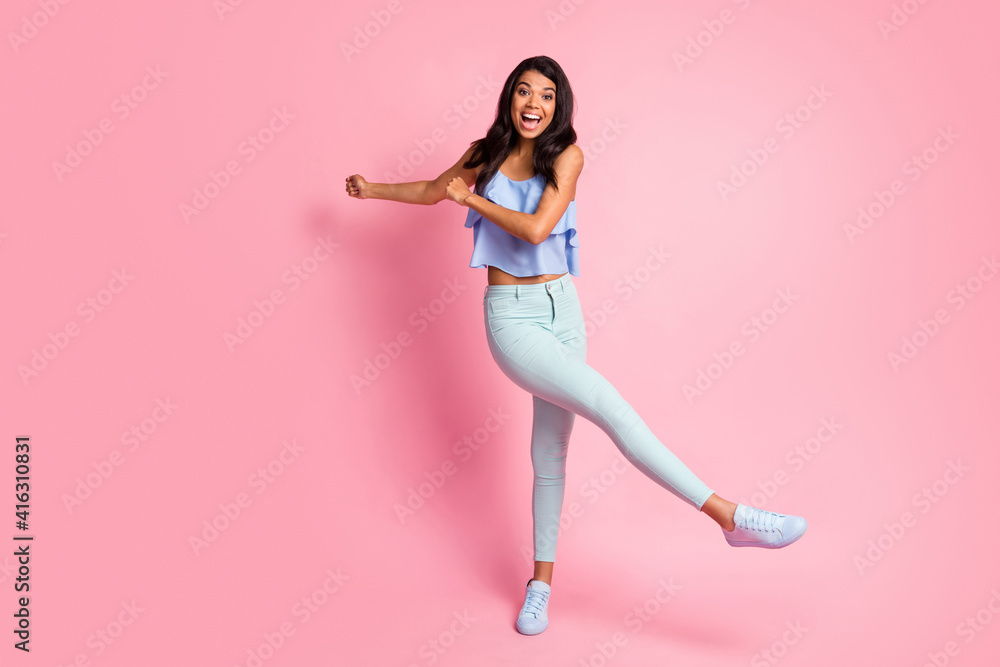 Full size photo of optimistic brunette lady dance wear blue top trousers sneakers isolated on pink color background Full size photo of optimistic brunette lady dance wear blue top trousers sneakers isolated on pink color background