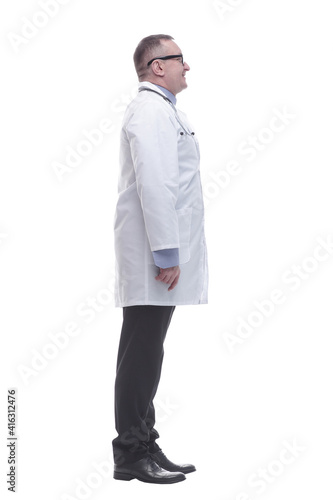 side view. smiling mature doctor looking forward
