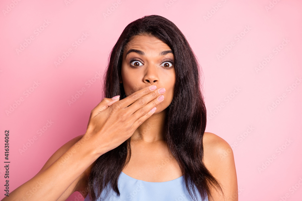 Portrait of optimistic brunette lady blow kiss wear blue top isolated on pastel pink color background Portrait of optimistic brunette lady blow kiss wear blue top isolated on pastel pink color background