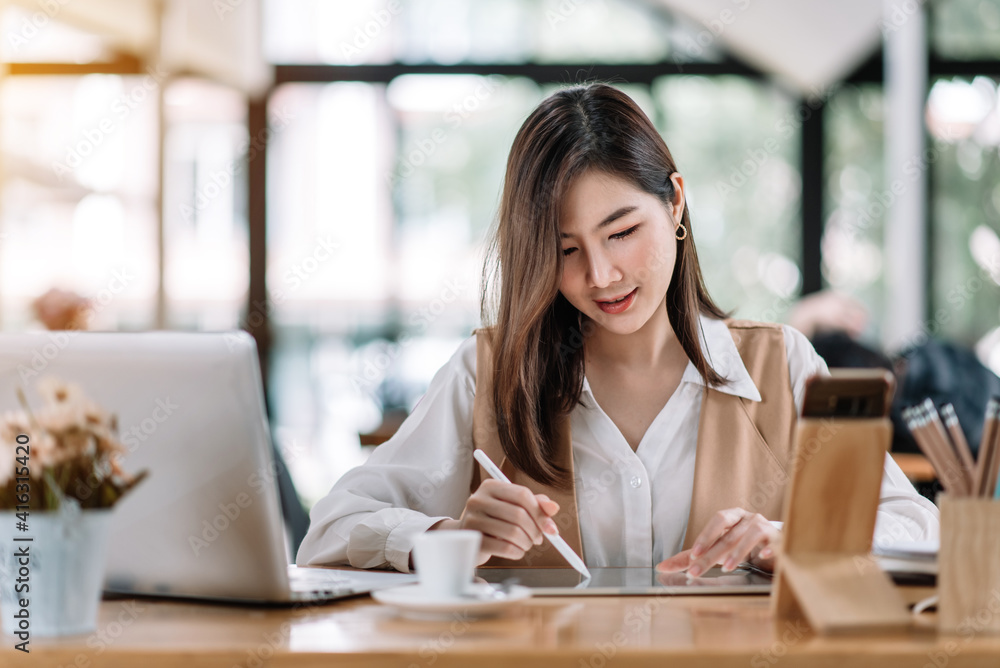 Beautiful Asian business woman working at the office With tablet. Beautiful Asian business woman working at the office With tablet.
