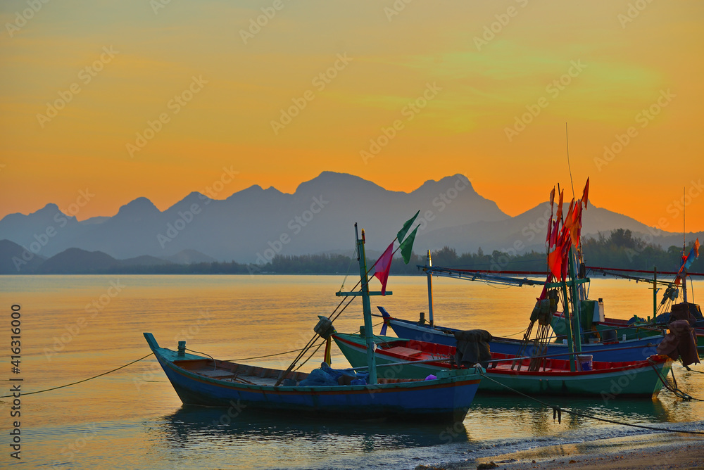 Fishing boat on the beach in evening. Thailand.