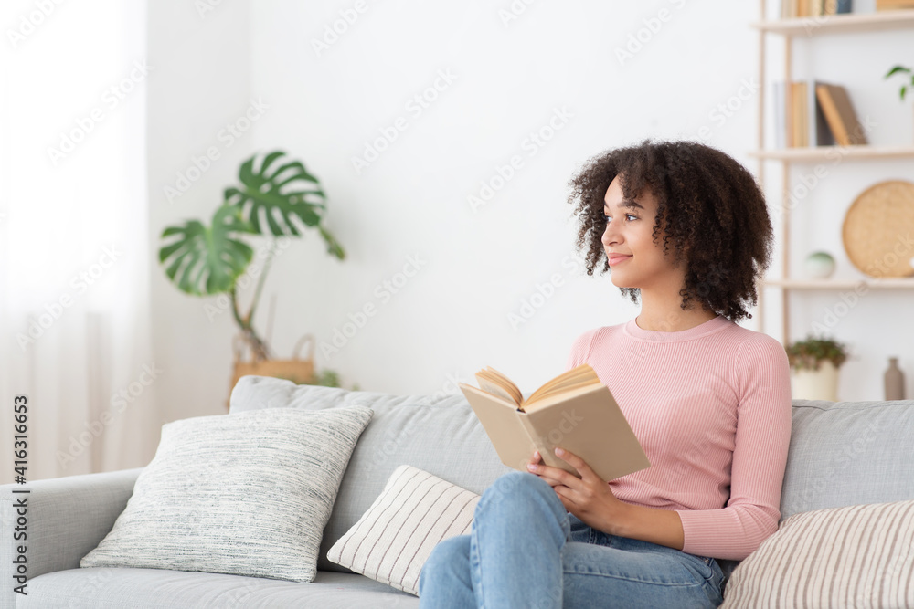 Serene pretty young african american woman feel relaxed, lady dream enjoy wellbeing breathing fresh air Serene pretty young african american woman feel relaxed, lady dream enjoy wellbeing breathing fresh air