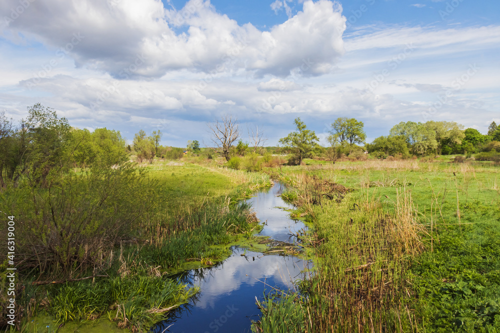small river flows through a beautiful landscape small river flows through a beautiful landscape