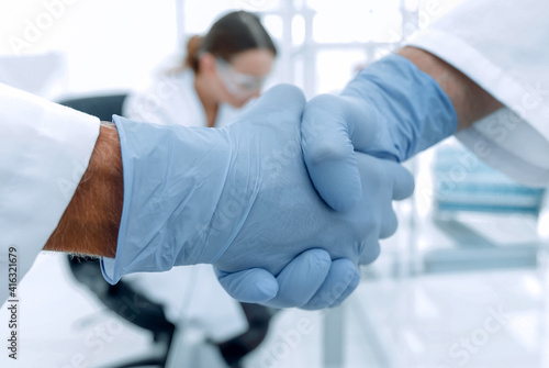 hand in the medical glove  handshake 