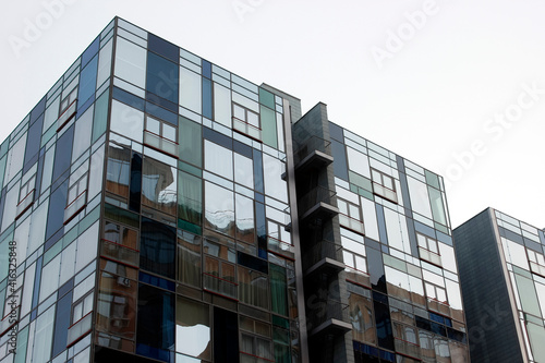 New modern architectural building house. Fragment of modern architecture, walls made of glass and concrete.