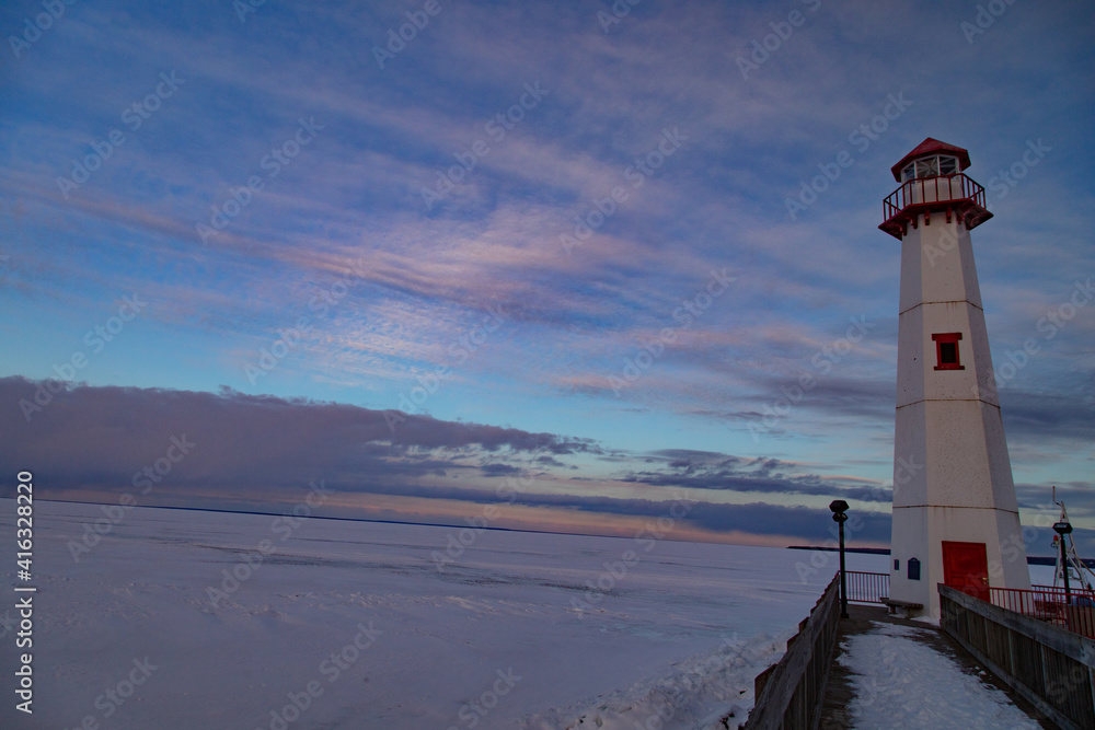 Wawatam lighthouse during winter in St. Ignace, Michigan. Wawatam lighthouse during winter in St. Ignace, Michigan.