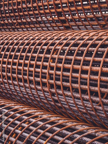 Iron on construction site. Iron reinforcement concrete . rebar for reinforce hole in the ground. Texture background net metal red