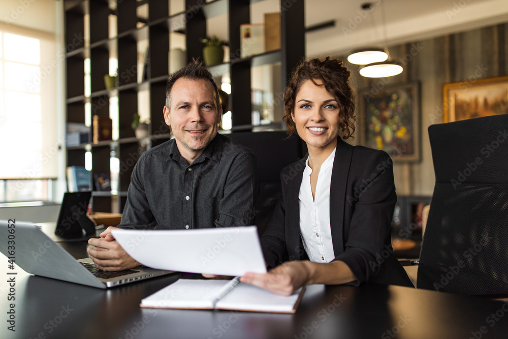 Portrait of a two successful business partners at work. Portrait of a two successful business partners at work.