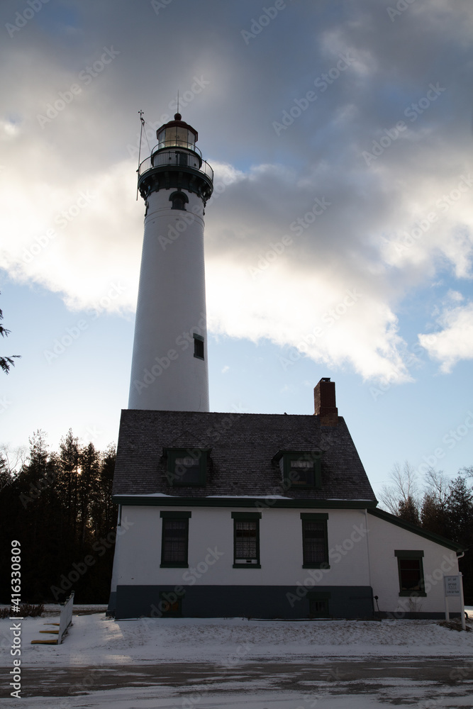 New Presque Isle Lighthouse in Michigan during the winter.