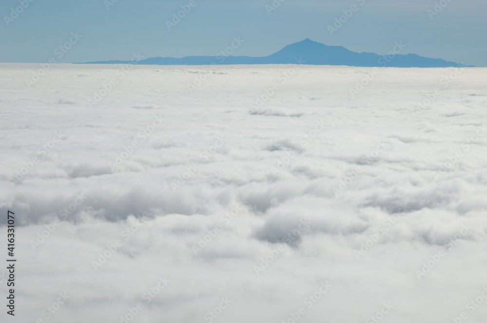 Sea of clouds and island of Tenerife with the Teide peak from La Palma. Canary Islands. Spain. Sea of clouds and island of Tenerife with the Teide peak from La Palma. Canary Islands. Spain.