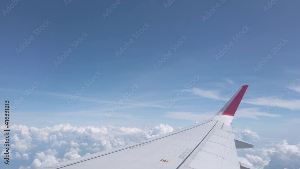 Sky from airplane with wing fly over cloud in summer sunshine day in Bangkok Sky from airplane with wing fly over cloud in summer sunshine day in Bangkok