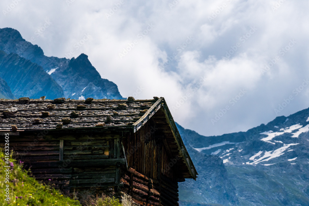 rural alpine wooden cabin with view to the mountains