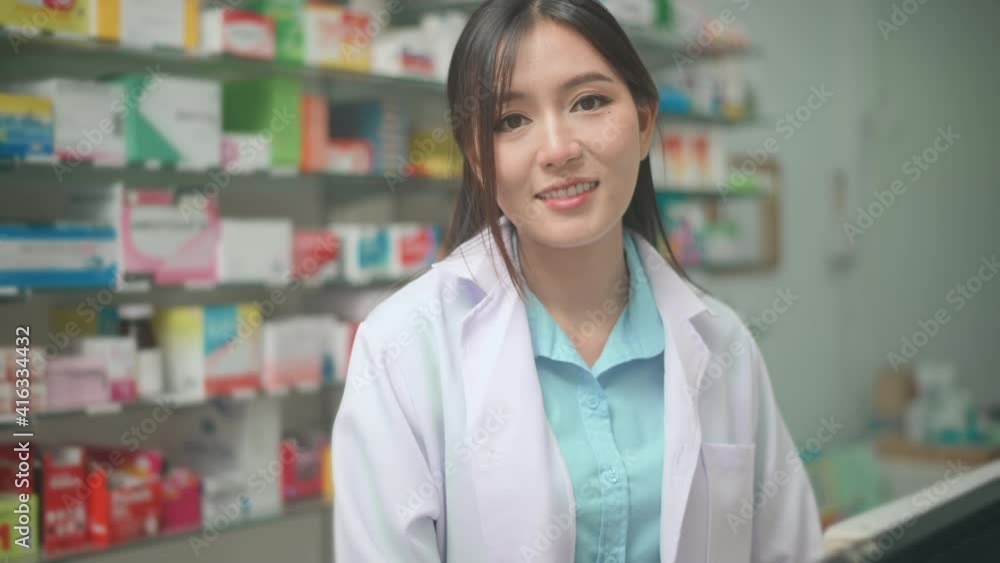 Portrait of asian woman pharmacist wearing lab coat in a modern pharmacy drugstore. Portrait of asian woman pharmacist wearing lab coat in a modern pharmacy drugstore.