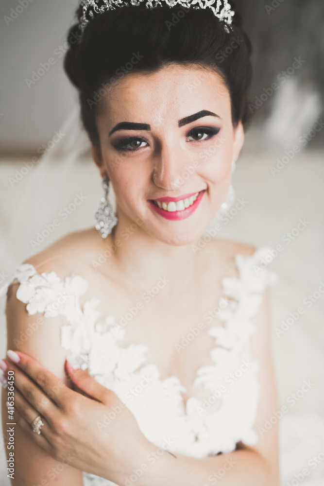Portrait of beautiful bride with fashion veil at wedding morning Portrait of beautiful bride with fashion veil at wedding morning