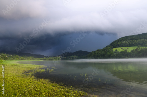 Storm cloud over the lake in the mountains, Bieszczady Mountains