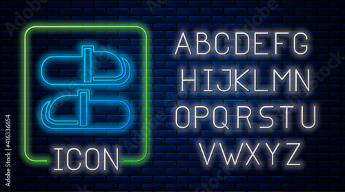 Glowing neon Sauna slippers icon isolated on brick wall background. Neon light alphabet. Vector.