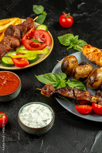 Kebap, roasted meat and vegetables on grill