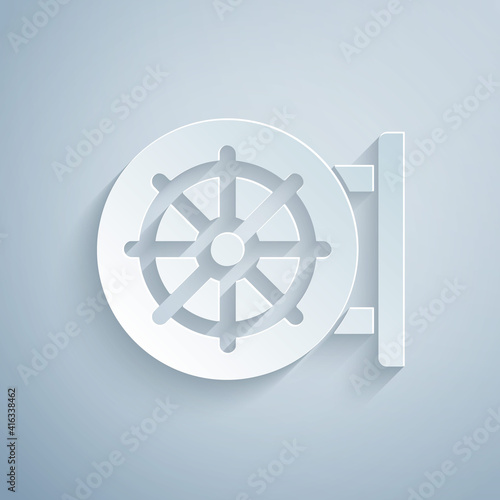 Paper cut Dharma wheel icon isolated on grey background. Buddhism religion sign. Dharmachakra symbol. Paper art style. Vector.