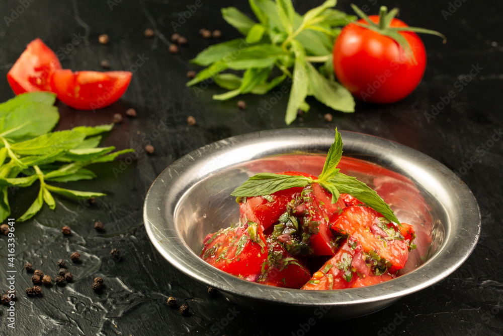Tomatoes salad with greens and mint Tomatoes salad with greens and mint