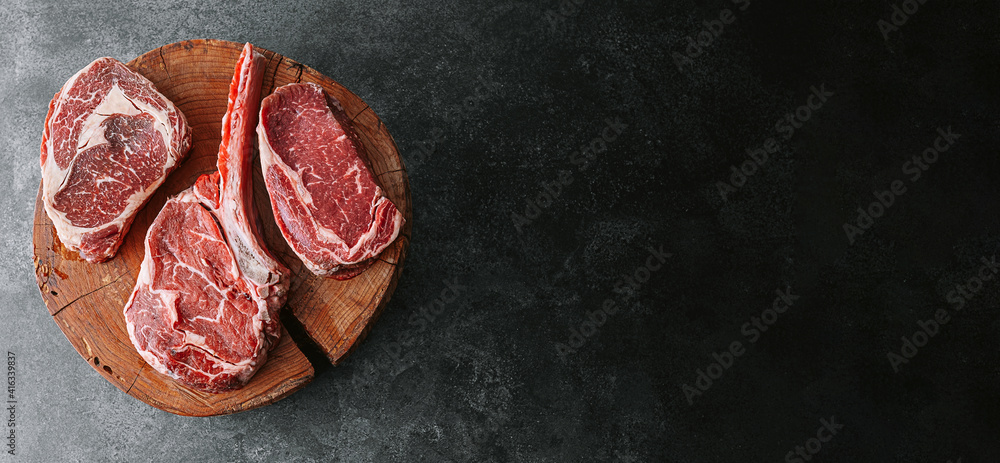 Fresh raw Prime Black Angus beef steaks. Variety of raw beef meat steaks for grilling.