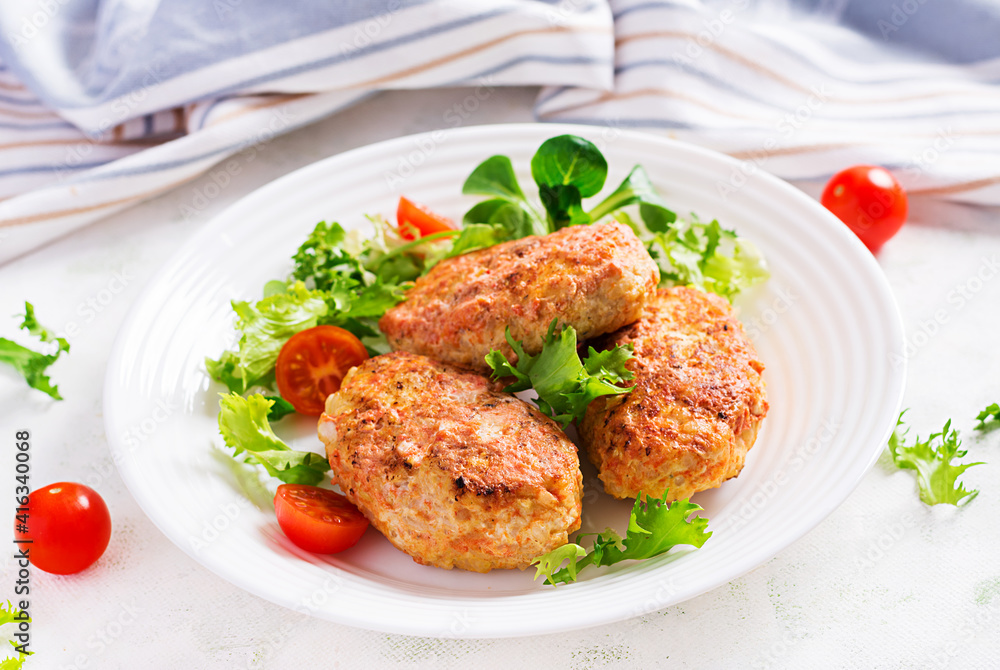 Meatballs with cabbage. Lazy cabbage rolls with fresh salad on light background. Russian cuisine. Meatballs with cabbage. Lazy cabbage rolls with fresh salad on light background. Russian cuisine.