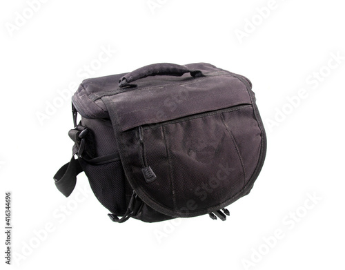 Old black camera bag on white background