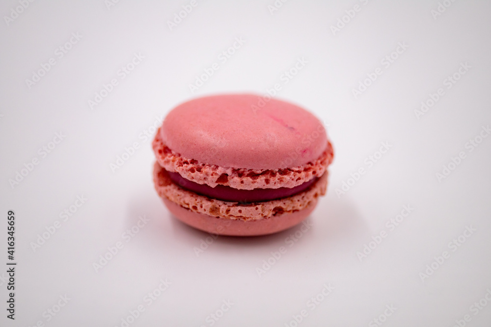Colorful pink macaron on a white background. Clipping path, isolated Colorful pink macaron on a white background. Clipping path, isolated