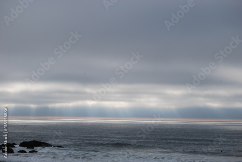 ocean beach with waves, in the sunrise & clouds 