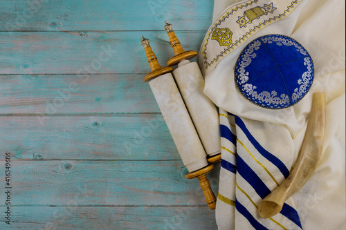 Jewish Orthodox religious symbols prayer book with torah scroll and shofar horn, prayer shawl tallit photo