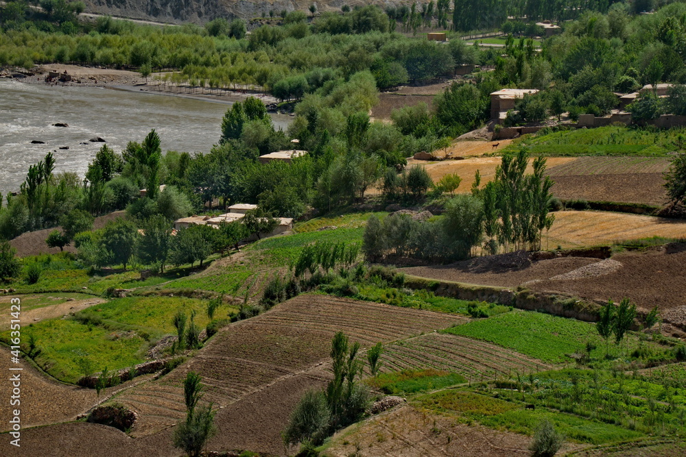 Afghanistan. The Pamir highway. Cultivated stony land on the left bank of the border river Panj.