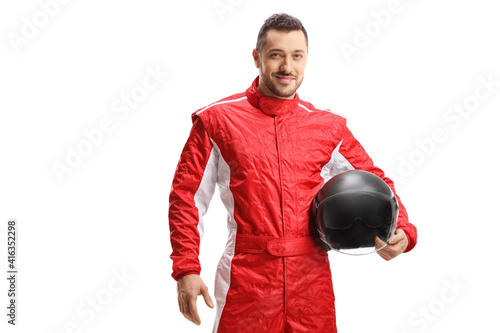 Fényképezés Man racer in a red uniform holding a helmet and smiling