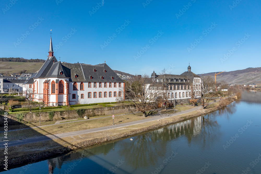 skyline of Bernkastel-Kues with river Mosel and Cusanus Stift