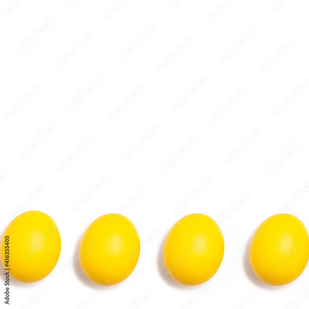 Bright yellow Easter eggs isolated on a white background Bright yellow Easter eggs isolated on a white background